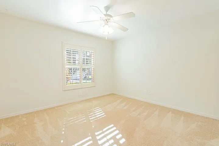 Unfurnished 3rd bedroom with carpet floors and ceiling fan