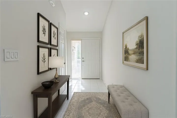 Virtually staged entryway with tile patterned flooring