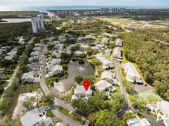 View of property location with a large body of water and nearby suburban area