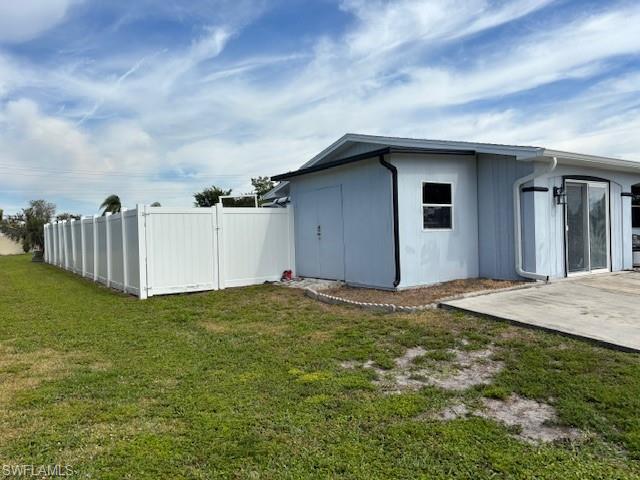left side of house w/ attached shed