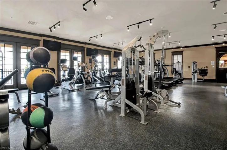 Workout area featuring french doors