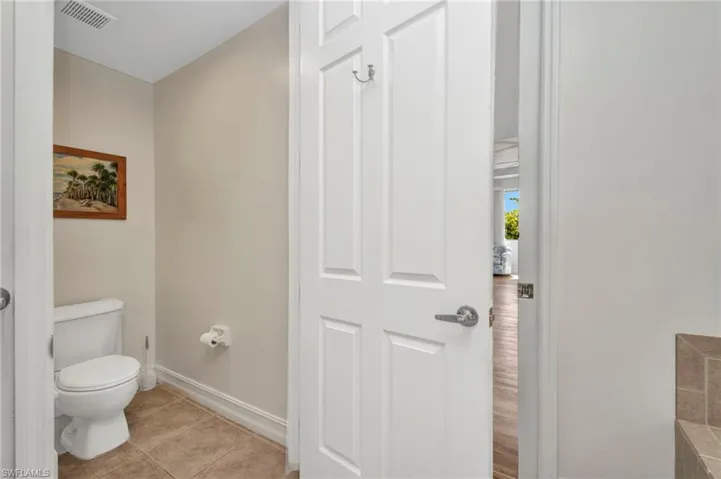 Bathroom with baseboards and tile patterned floors
