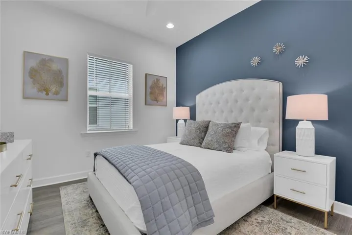 Bedroom featuring baseboards, recessed lighting, and wood finished floors