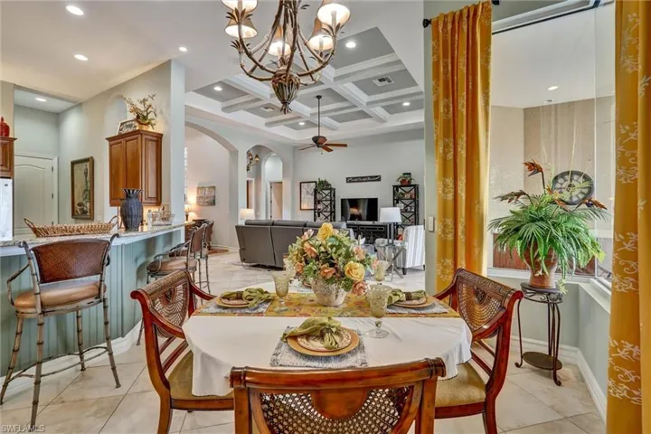 Formal dining area featuring tile flooring and an ornate chandelier
