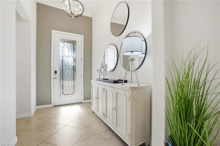 A bright and airy entryway welcomes you in - marking the hallway to two of the guest bedrooms