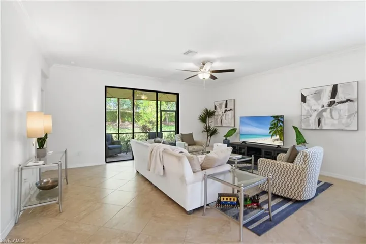 The sitting area looks out over the luscious green landscaping