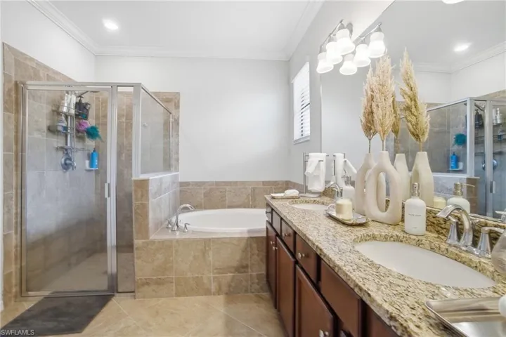 The Primary Bath has dual sinks and a soaking tub welcoming you to rest and relax