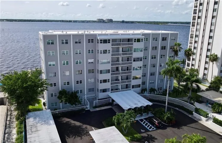View of property with a water view