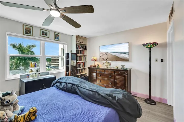 Bedroom with light hardwood / wood-style flooring and ceiling fan