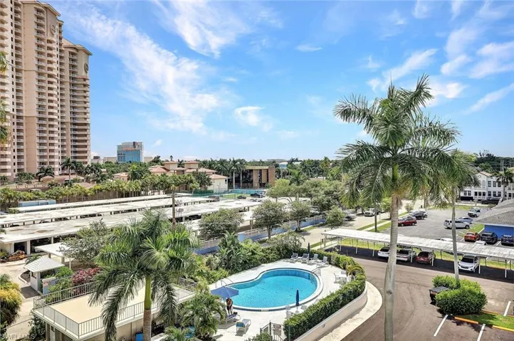 Balcony featuring a community pool