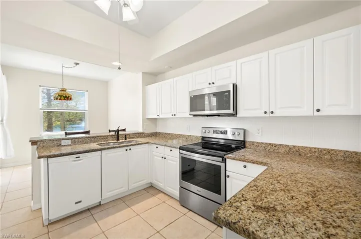 Breakfast bar, eat in nook by lake plus formal dining opposite
