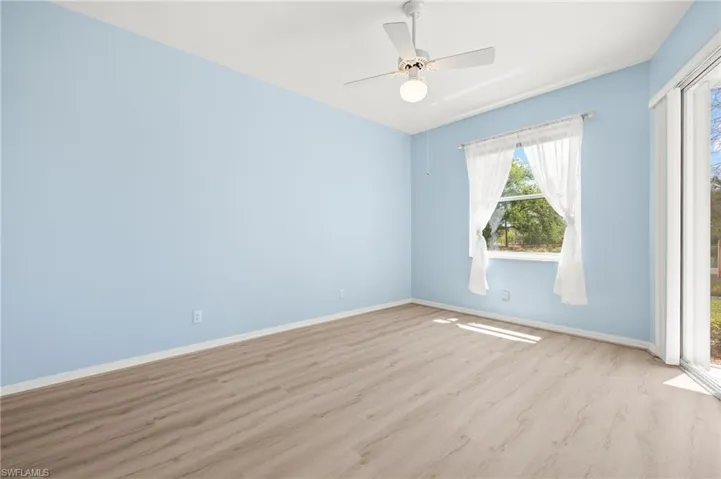 Expansive primary suite with sliders to lanai