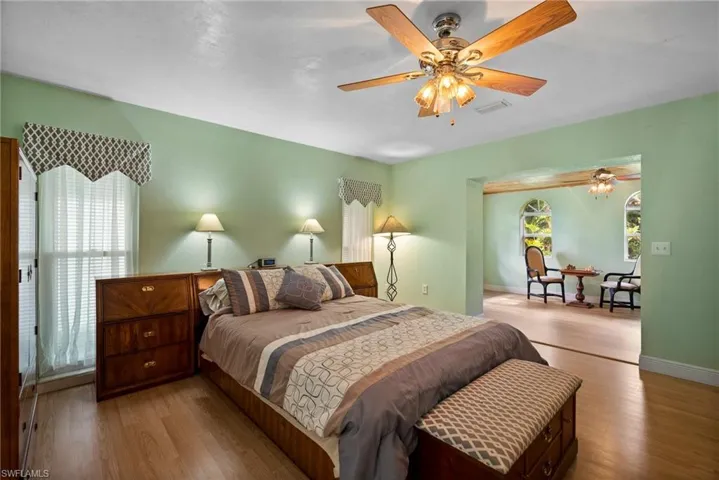 Bedroom featuring hardwood / wood-style flooring and ceiling fan