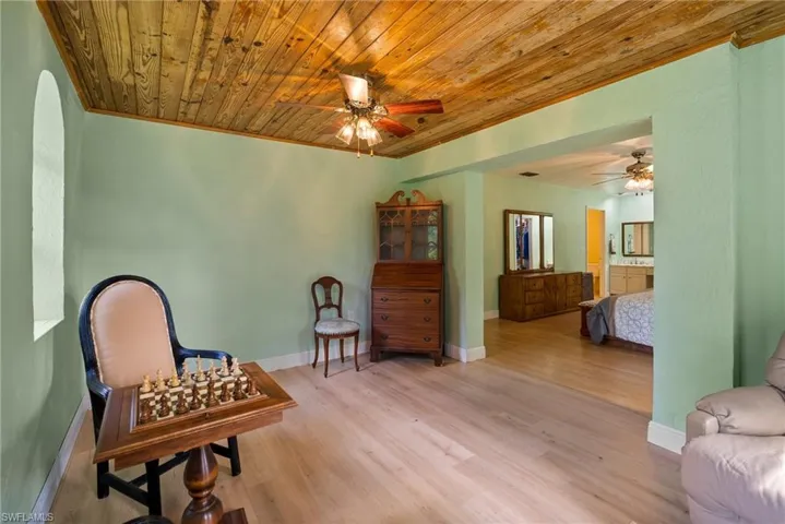 Sitting room with wood ceiling, hardwood / wood-style floors, and ceiling fan