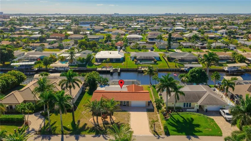 View of property location featuring a nearby body of water and nearby suburban area