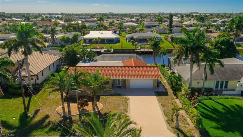 Aerial view of residential area with a large body of water