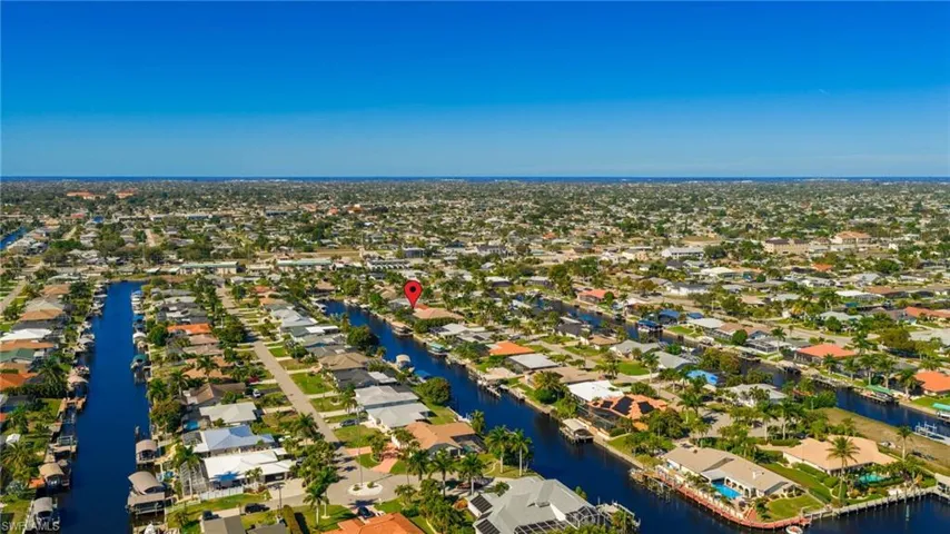 View of property location featuring nearby suburban area and a large body of water