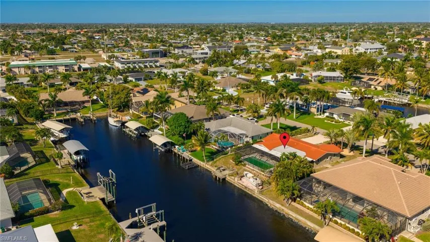 View of property location with a large body of water and nearby suburban area
