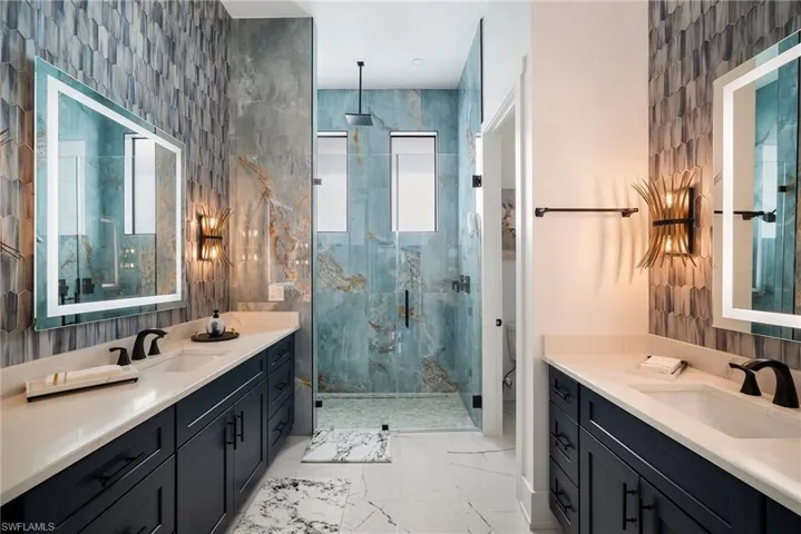 Bathroom with vanity, toilet, and walk in shower