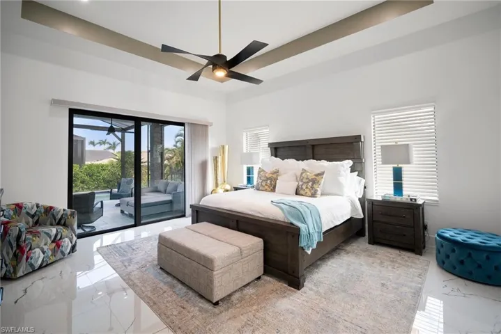 Bedroom featuring access to exterior and ceiling fan
