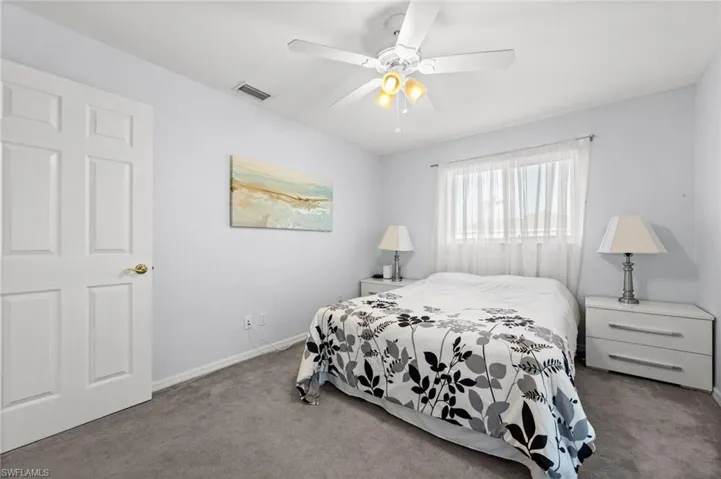 Bedroom with carpet and a ceiling fan
