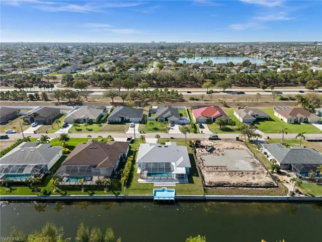 Aerial overview of property's location with nearby suburban area