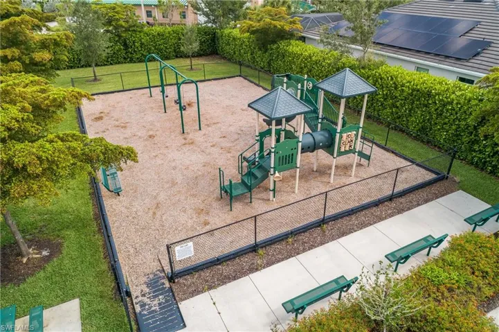 View of playground with a lawn