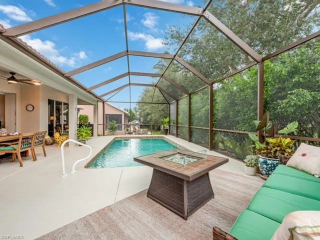 View of swimming pool featuring a patio area, outdoor lounge area, and ceiling fan
