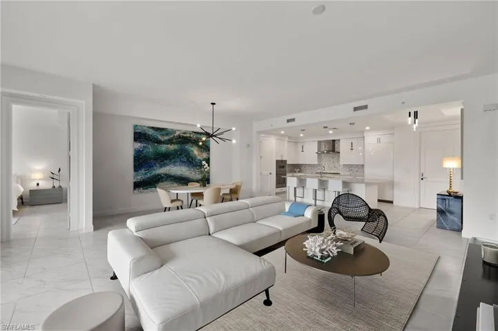 Living room with sink and a chandelier