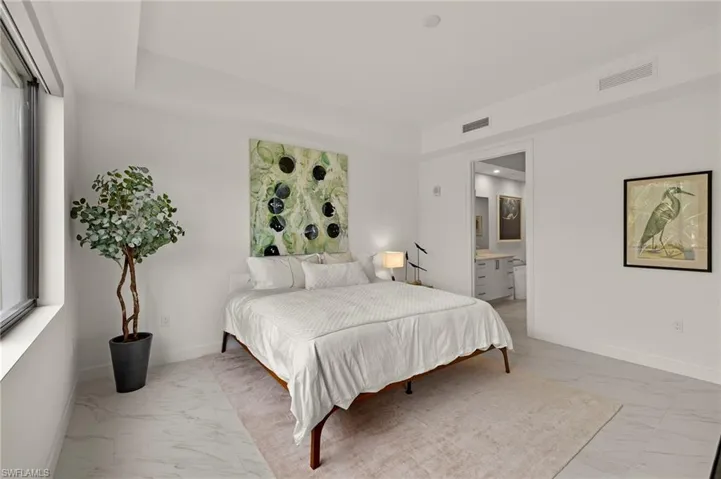 Bedroom featuring ensuite bath