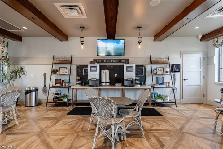 Kitchen featuring beam ceiling and hanging light fixtures