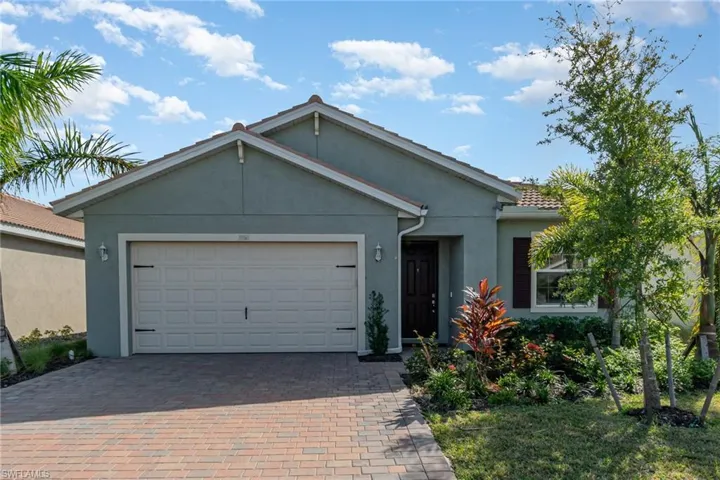 Ranch-style house featuring a garage