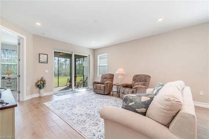 Living room with light hardwood / wood-style floors