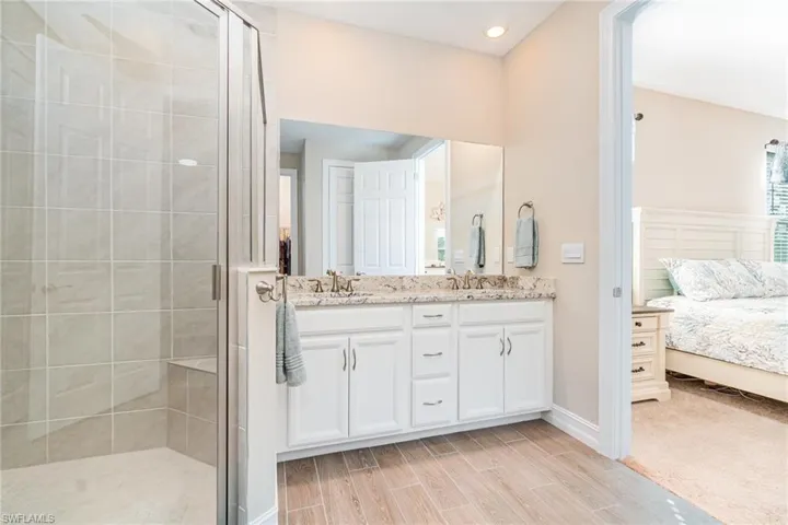 Bathroom with double bowl vanity and shower