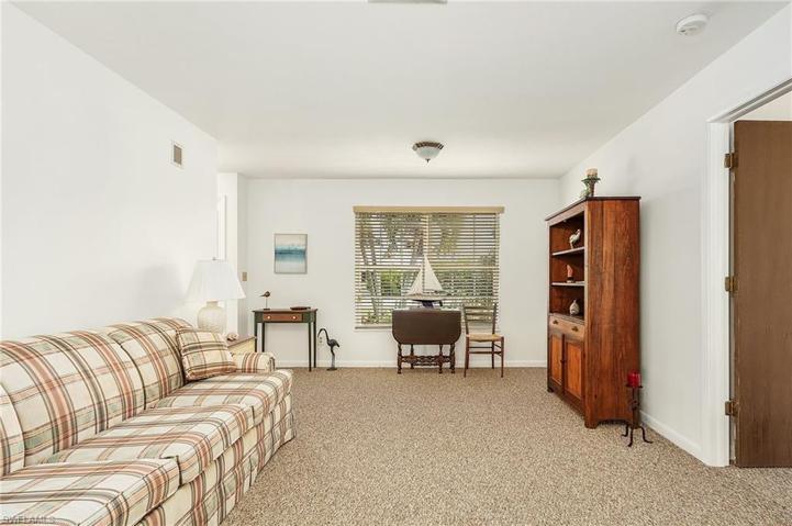 Living room with new carpet and sleeper sofa.