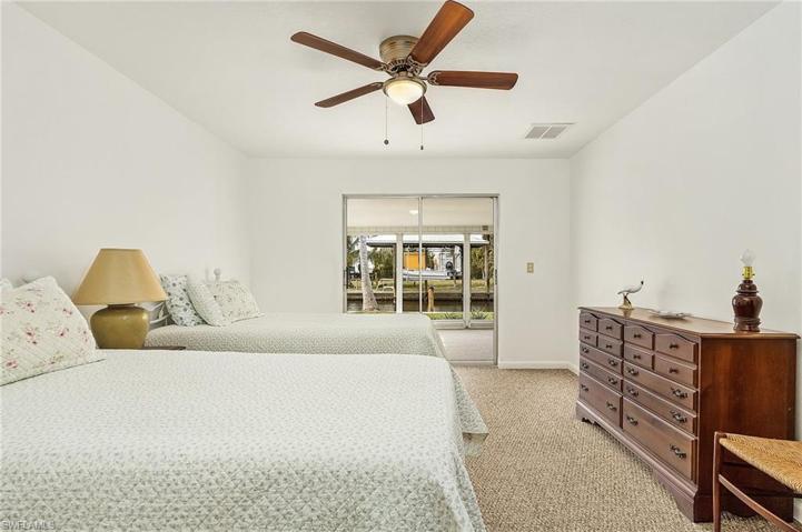 Master Bedroom has sliders to screened porch.