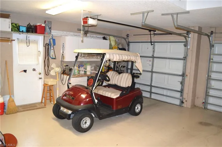 Three car garage with included golf cart