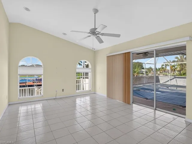 Vaulted ceiling with recessed lighting and a ceiling fan