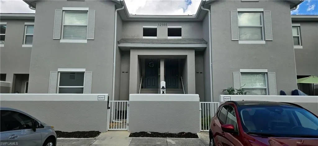 View of front facade featuring stucco siding.