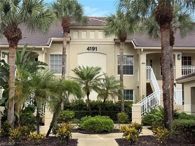View of property with stairway