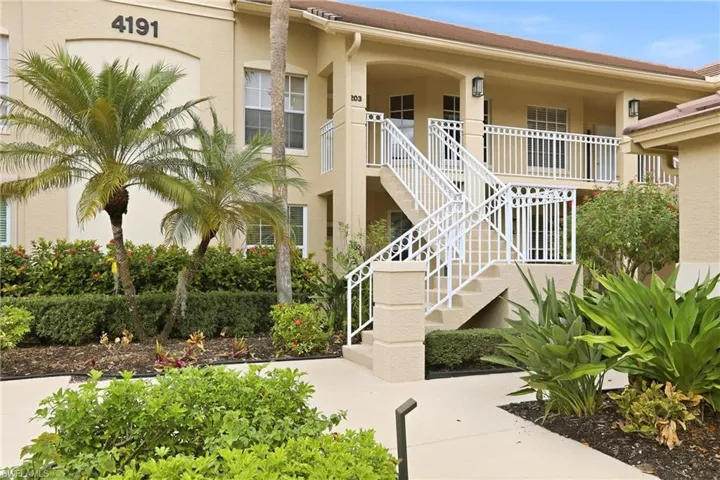 View of property featuring stairway