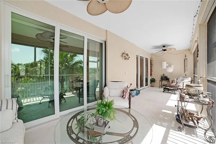 Sunroom featuring ceiling fan