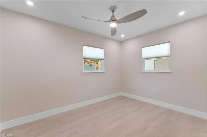 #2 bedroom with light wood-style flooring, recessed lighting, and a ceiling fan, 2 windows