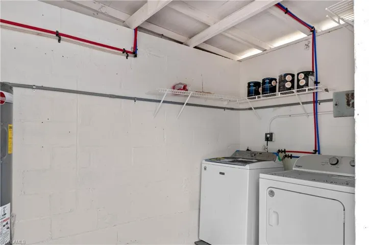 Out back Laundry area with independent washer and dryer