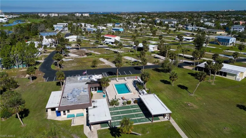 Aerial view of property's location featuring a pool