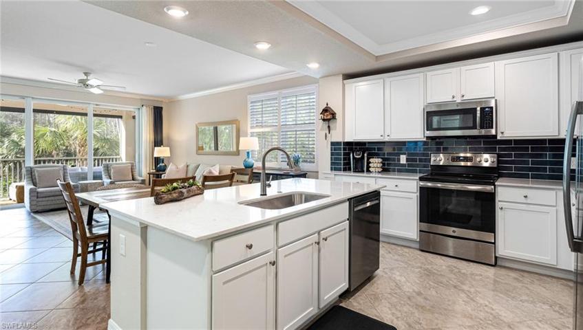 quartz counters and stylish backsplash