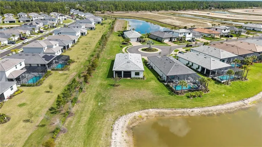 Aerial view of residential area with a large body of water