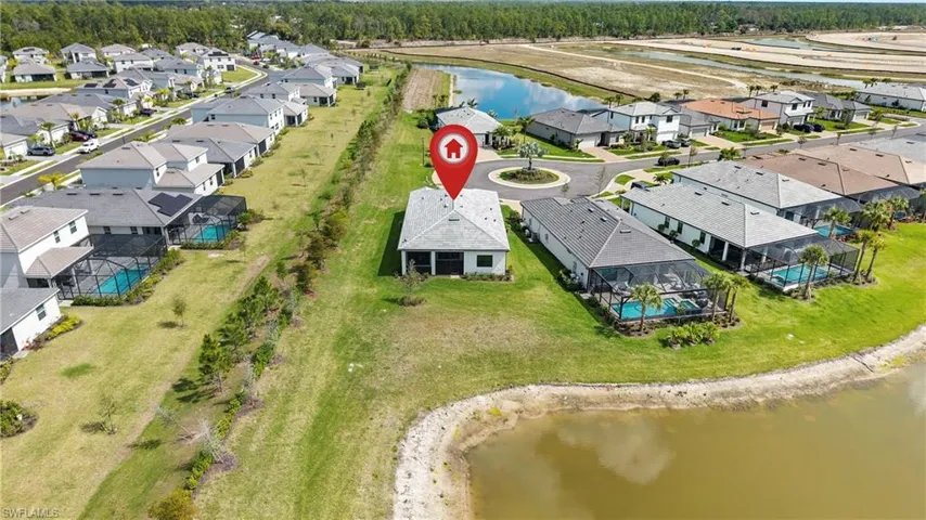 Aerial perspective of suburban area with a large body of water