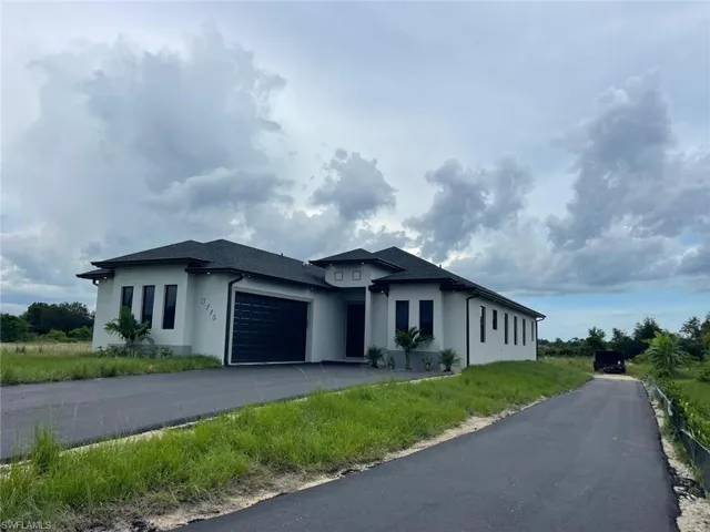 View of front of property with a garage
