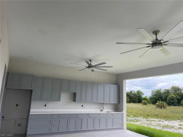 Garage with sink and ceiling fan